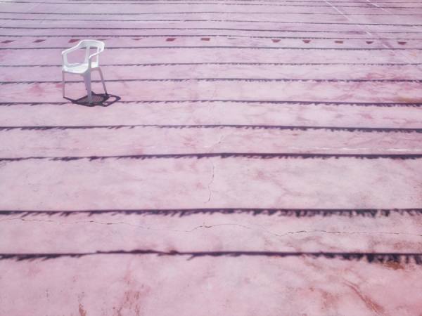 Photograph Chris Frazer Smith White Plastic Chair on One Eyeland